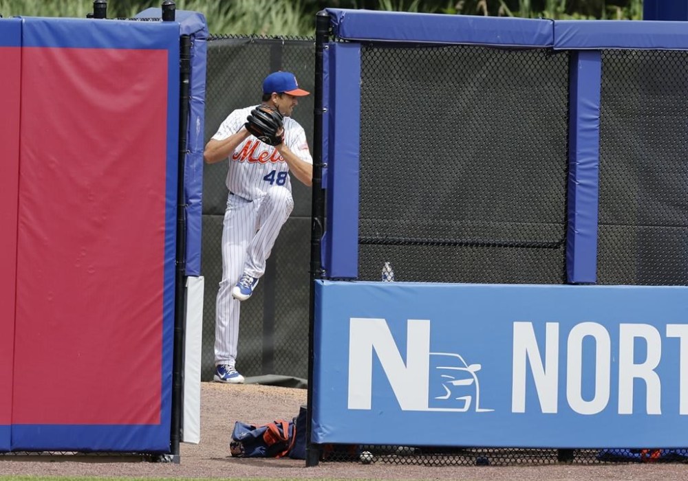 New York Mets pitcher Jacob deGrom warms up for a rehab start for Syracuse in a minor league baseball game against Omaha Wednesday, July 27, 2022, at NBT Bank Stadium in Syracuse, N.Y. (Scott Schild/The Post-Standard via AP)