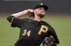 Pittsburgh Pirates starting pitcher JT Brubaker delivers during the first inning of a baseball game against the Philadelphia Phillies in Pittsburgh, Sunday, July 31, 2022. (AP Photo/Gene J. Puskar)