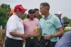Henrik Stenson, right, of Sweden, greets former President Donald Trump after winning the individual competition of the LIV Golf Invitational at Trump National in Bedminster, N.J., Sunday, July 31, 2022. (AP Photo/Seth Wenig)