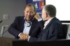 FILE - John Textor, a US digital entrepreneur, left, shakes hand with Lyon's soccer club president Jean-Michel Aulas, right, during a press conference to announce the Textor's takeover of the club, in Decines, near Lyon, central France, on June 21, 2022. (AP Photo/Laurent Cipriani, File)