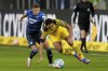 FILE - Hoffenheim's Christoph Baumgartner, left, and Dortmund's Jude Bellingham challenge for the ball during a German Bundesliga soccer match between TSG 1899 Hoffenheim and Borussia Dortmund in Sinsheim, Germany, on Jan. 22, 2022. (AP Photo/Michael Probst, File)