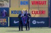 French defender Jules Kounde, right, poses with FC Barcelona president Joan Laporta during his official presentation after signing for FC Barcelona in Barcelona, Spain, Monday, Aug. 1, 2022. (AP Photo/Joan Monfort)