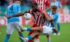 Union Berlin's Jordan Pefok, center, of the United States, and Chemnitz FC's Tim Campulka fight for the ball during a German Cup second-round soccer match in Chemnitz, Germany, Monday, Aug. 1, 2022. (Hendrik Schmidt/dpa via AP)