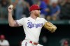 Texas Rangers starting pitcher Jon Gray throws to the Baltimore Orioles in the first inning of a baseball game, Monday, Aug. 1, 2022, in Arlington, Texas. (AP Photo/Tony Gutierrez)