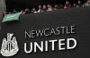 FILE - Newcastle United supporters celebrate outside St. James' Park in Newcastle Upon Tyne, England, Oct. 7, 2021. English Premier League club Newcastle has been sold to Saudi Arabia's sovereign wealth fund after a protracted takeover and legal fight involving concerns about piracy and rights abuses in the kingdom. (AP Photo/Scott Heppell, File)