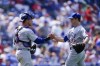 Chicago Cubs pitcher David Robertson, right, and catcher Yan Gomes celebrate after a baseball game against the Philadelphia Phillies, Sunday, July 24, 2022, in Philadelphia. (AP Photo/Matt Rourke)