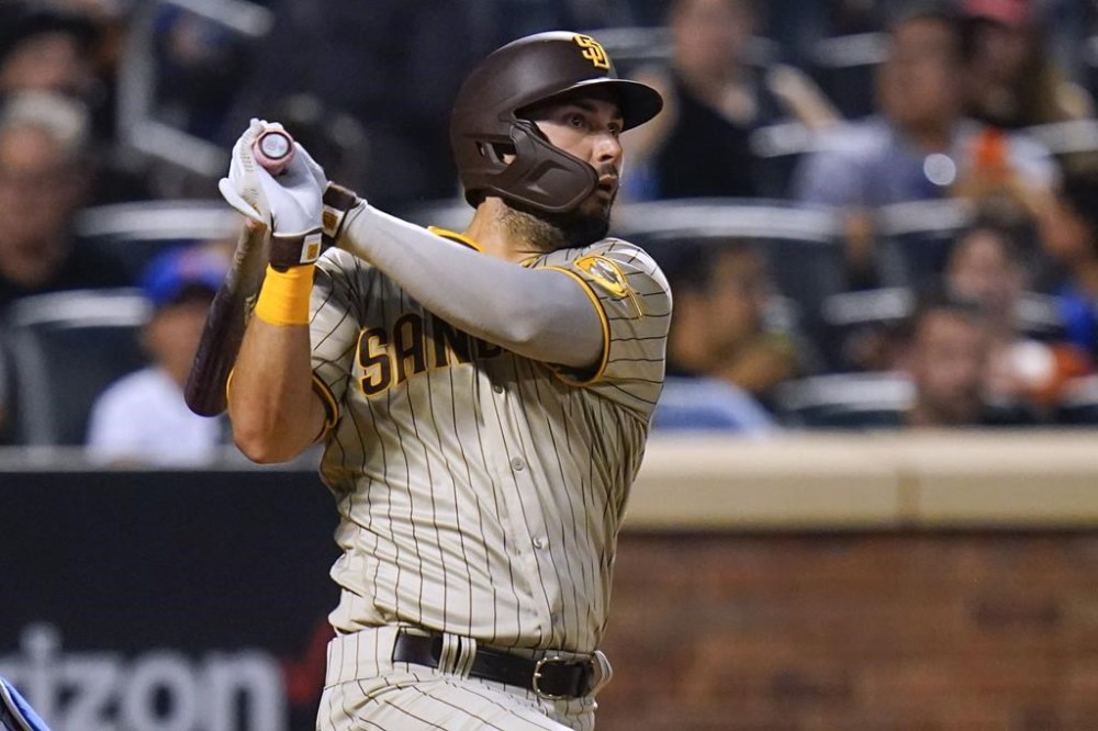 San Diego Padres' Eric Hosmer watches his single during the fifth inning of the team's baseball game against the New York Mets on Saturday, July 23, 2022, in New York. (AP Photo/Frank Franklin II)