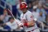 Cincinnati Reds' Kyle Farmer is hit by a pitch during the seventh inning of a baseball game against the Miami Marlins, Tuesday, Aug. 2, 2022, in Miami. (AP Photo/Wilfredo Lee)