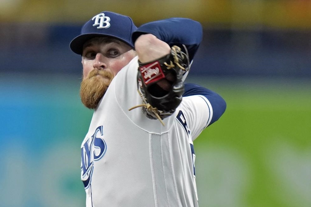 Tampa Bay Rays' Drew Rasmussen goes into his delivery against the Toronto Blue Jays during the first inning of a baseball game Tuesday, Aug. 2, 2022, in St. Petersburg, Fla. (AP Photo/Chris O'Meara)