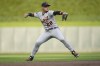 Detroit Tigers shortstop Javier Baez throws to first for the out on Minnesota Twins' Carlos Correa during the first inning of a baseball game Tuesday, Aug. 2, 2022, in Minneapolis. (AP Photo/Abbie Parr)
