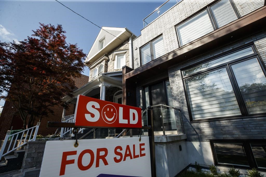 ‘Wait and see’ Toronto, Vancouver home sales plummet from 2021 as