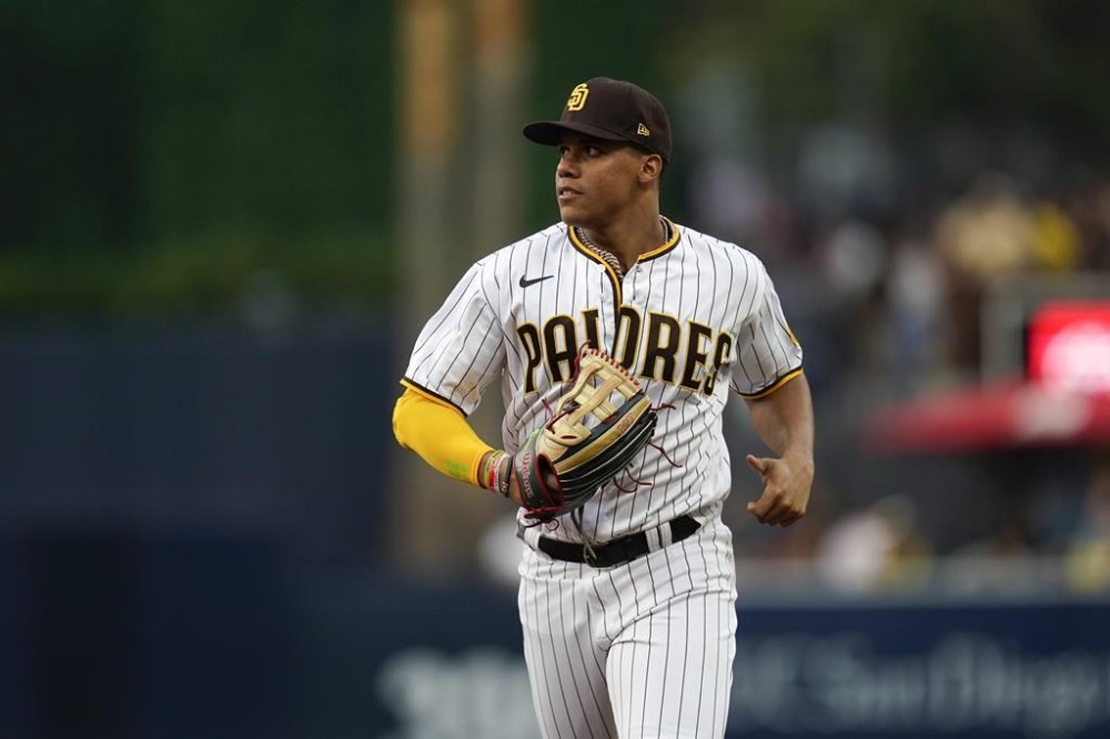 San Diego Padres right fielder Juan Soto runs to the dugout during the second inning of the team's baseball game against the Colorado Rockies, Wednesday, Aug. 3, 2022, in San Diego. (AP Photo/Gregory Bull)