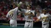 Oakland Athletics' Sean Murphy (12) celebrates his two-run home run with Elvis Andrus (17) during the sixth inning of the team's baseball game against the Los Angeles Angels on Wednesday, Aug. 3, 2022, in Anaheim, Calif. (AP Photo/Marcio Jose Sanchez)