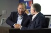 FILE - John Textor, a US digital entrepreneur, left, shakes hand with Lyon's soccer club president Jean-Michel Aulas, right, during a press conference to announce the Textor's takeover of the club, in Decines, near Lyon, central France, on June 21, 2022. (AP Photo/Laurent Cipriani, File)
