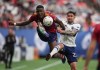 Real Salt Lake's Sergio Cordova, left, and Vancouver Whitecaps' Erik Godoy vie for the ball during the first half of an MLS soccer game in Vancouver, on Saturday, June 4, 2022. THE CANADIAN PRESS/Darryl Dyck