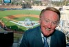 FILE - Los Angeles Dodgers broadcaster Vin Scully poses in the pressbox of Dodger Stadium before the start of a baseball game between the San Francisco Giants and the Dodgers on Aug. 1, 2007, in Los Angeles. The Hall of Fame broadcaster, whose dulcet tones provided the soundtrack of summer while entertaining and informing Dodgers fans in Brooklyn and Los Angeles for 67 years, died Tuesday night, Aug. 2, 2022. He was 94. (AP Photo/Mark J. Terrill, File)