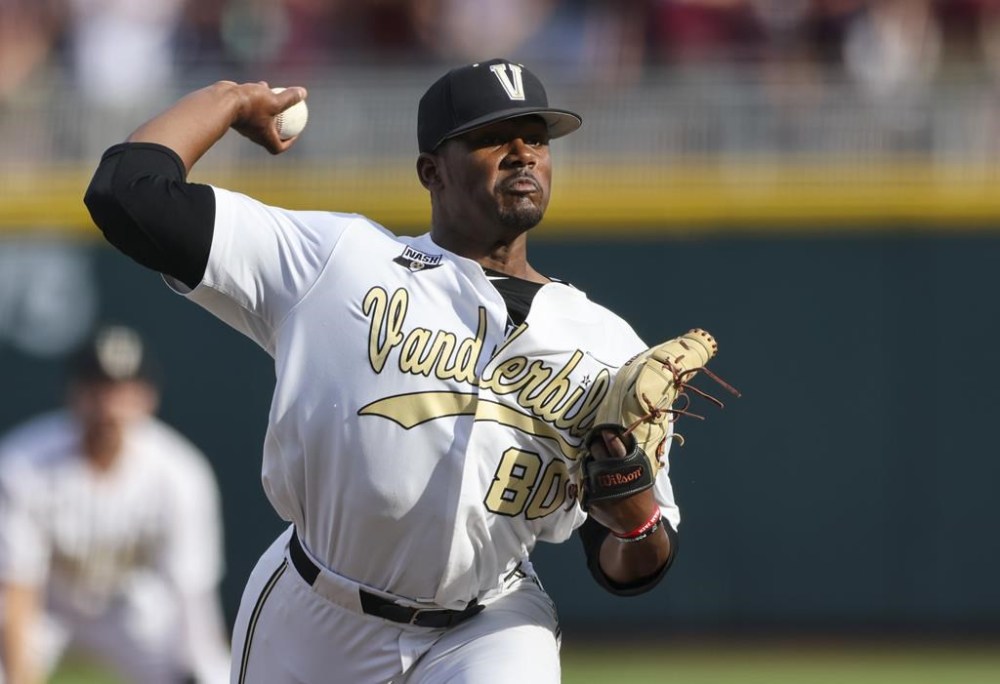 FILE - Vanderbilt pitcher Kumar Rocker (80) throws during the first inning in Game 3 of the NCAA College World Series baseball finals on June 30, 2021, in Omaha, Neb. Third overall pick Kumar Rocker signed with the Texas Rangers on Tuesday, July 26, 2022, a week after the right-handed pitcher was drafted again and a year after concerns over a physical led to him going unsigned by the New York Mets as the 10th overall pick.
Rocker got a $5.2 million bonus from the Rangers. (AP Photo/Rebecca S. Gratz, File)