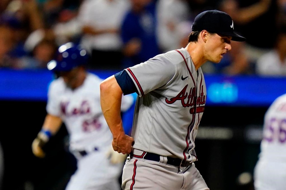 Atlanta Braves starting pitcher Kyle Wright waits as New York Mets' Tyler Naquin runs the bases after hitting a home run during the sixth inning of a baseball game Thursday, Aug. 4, 2022, in New York. (AP Photo/Frank Franklin II)