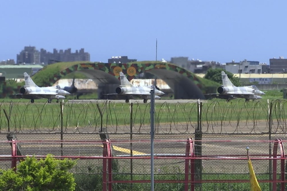Taiwan Air Force Mirage fighters sit on the tarmac at an airbase in Hsinchu, Taiwan, Friday, Aug. 5, 2022. China says it summoned European diplomats in the country to protest statements issued by the Group of Seven nations and the European Union criticizing threatening Chinese military exercises surrounding Taiwan. (AP Photo/Johnson Lai)