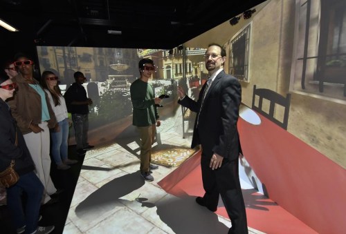 Villanova professor Frank Klassner uses the university's CAVE facility to give students a virtual tour of the Piazza Di Espagna in Rome on Oct. 2, 2014. (Villanova University via AP)