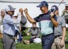 Padraig Harrington, right, celebrates his first round win with Doug Barron during the PGA Tour Champion's Shaw Charity Classic golf event in Calgary, Alta., Friday, Aug. 5, 2022.THE CANADIAN PRESS/Jeff McIntosh