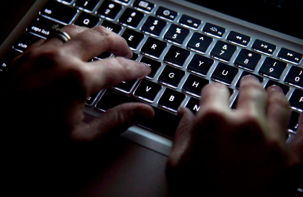 A woman uses her computer keyboard to type while surfing the internet in North Vancouver, B.C., on December 19, 2012. THE CANADIAN PRESS/Jonathan Hayward