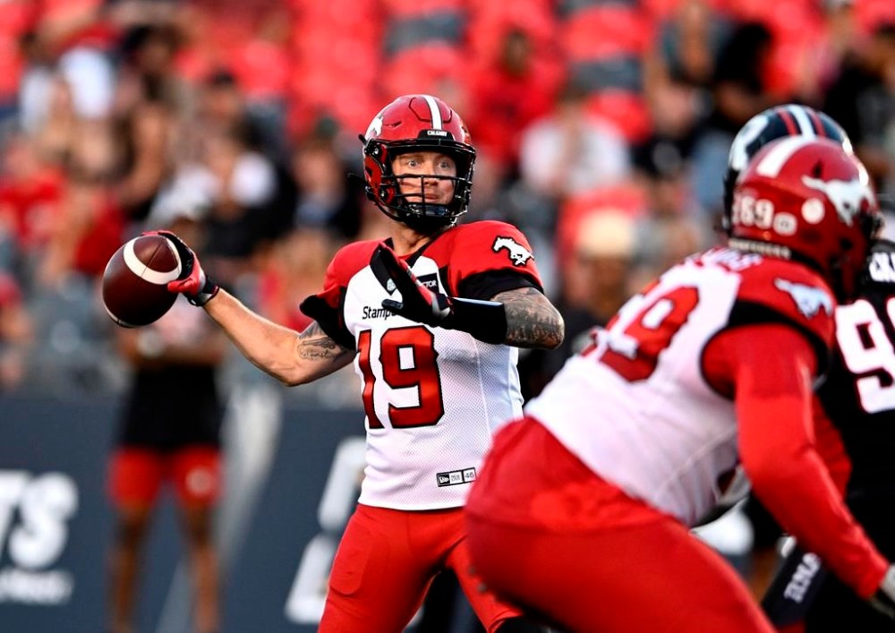 Calgary Stampeders quarterback Bo Levi Mitchell (19) throws the ball during first half CFL football action against the Ottawa Redblacks in Ottawa on Friday, Aug. 5, 2022. THE CANADIAN PRESS/Justin Tang