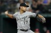 Chicago White Sox relief pitcher Joe Kelly throws to the Texas Rangers in the seventh inning of a baseball game, Friday, Aug. 5, 2022, in Arlington, Texas. (AP Photo/Tony Gutierrez)