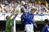 Everton's goalkeeper Jordan Pickford, left, makes a save during the English Premier League soccer match between Everton and Chelsea at Goodison Park in Liverpool, England, Saturday, Aug. 6, 2022. (AP Photo/Jon Super)