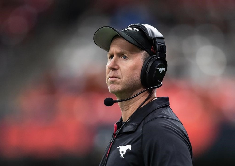 Calgary Stampeders head coach Dave Dickenson stands on the sideline during the first half of a CFL football game against the B.C. Lions in Vancouver, on Saturday, October 16, 2021. THE CANADIAN PRESS/Darryl Dyck