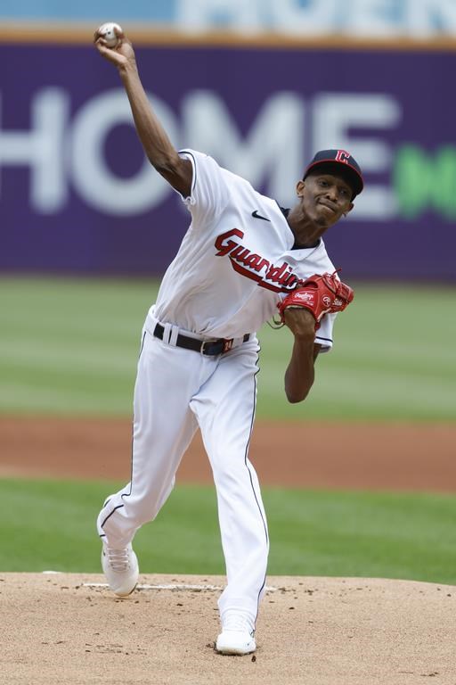 Cleveland Guardians starting pitcher Triston McKenzie delivers against the Houston Astros during the first inning of a baseball game, Sunday, Aug. 7, 2022, in Cleveland. (AP Photo/Ron Schwane)