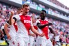 Cologne's Luca Kilian, left, celebrates with Kingsley Schindler after scoring during the German Bundesliga soccer match between Shcalke 04 and 1. FC Cologne in Cologne, Germany, Sunday, Aug. 7, 2022. (Tom Weller/dpa via AP)