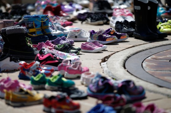 JOHN WOODS / WINNIPEG FREE PRESSShoes placed at a memorial at Oodena Circle in Winnipeg after the remains of 215 children were discovered near the site of a former residential school in Kamloops, B.C. (John Woods / Winnipeg Free Press files)