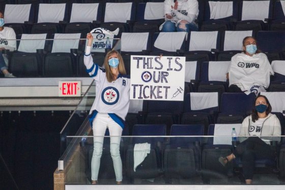 Health-care workers cheer during Game 1 at Bell MTS Place. (Mikaela MacKenzie / Winnipeg Free Press files)