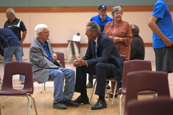 Premier Brian Pallister (right) speaks with former provincial cabinet minister Harold Gilleshammer in Minnedosa on Monday. (Matt Goerzen / Brandon Sun)
