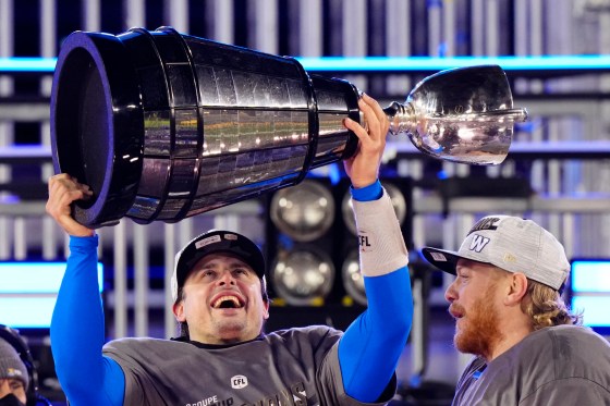 Blue Bombers quarterback Zach Collaros hoists the Grey Cup. He was named the most valuable player of the game. (Frank Gunn / The Canadian Press)