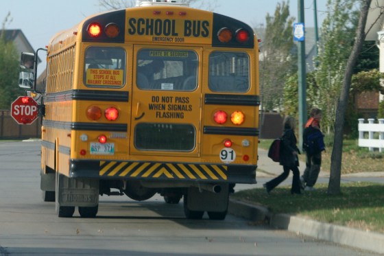 BORIS MINKEVICH / WINNIPEG FREE PRESS FILESSchool bus drivers in Louis Riel School Division will 'visually assess' students and their parents or guardians for flu symptoms.