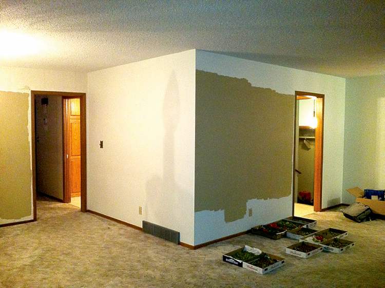 The living room as it appeared before the wall that enclosed the kitchen was removed.
