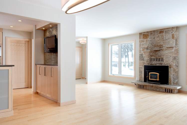 The living room with original wood-burning fireplace. At top, the newly renovated kitchen features an island.