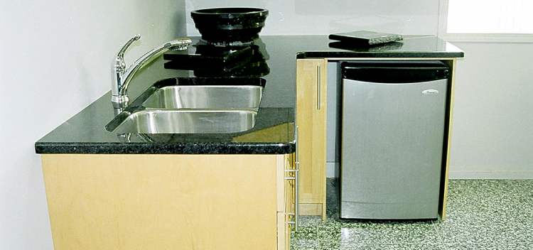 Granite countertop with birch and maple cabinet.
