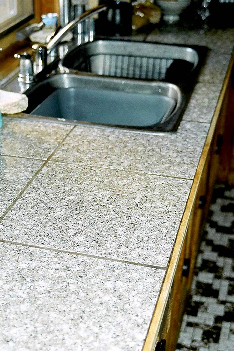 DIY engineered granite tile countertop and backsplash.