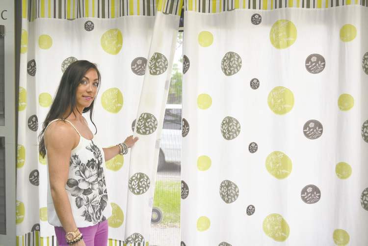 Lindsay Buus with an in-house designed drape created for the company's showroom.