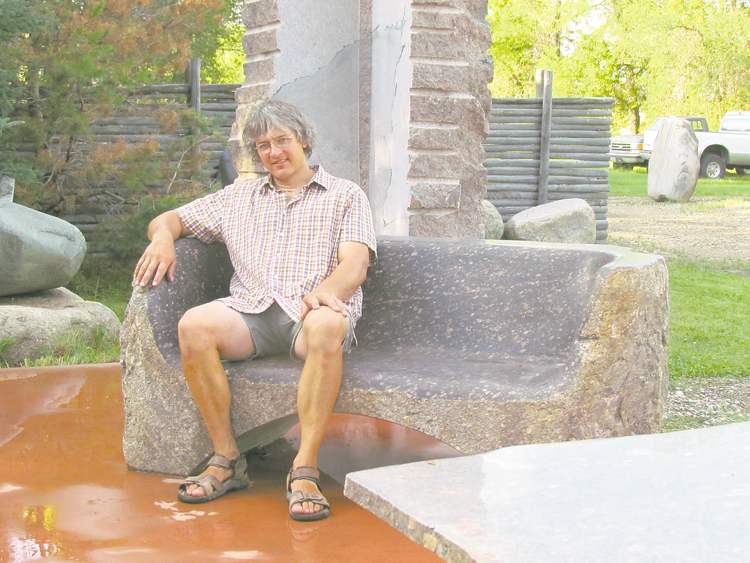 Colleen Zacharias
Local stone carver Todd Braun relaxes on a granite bench that has been smoothly polished.