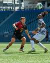 ETHAN CAIRNS / WINNIPEG FREE PRESS
                                Valour FC&rsquo;s Matthew Catavolo (left) keeps an eye on the ball and Pacific FC&rsquo;s Georges Mukumbilwa in CPL action Saturday at IG Field..