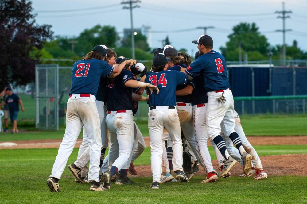 The Elmwood Giants celebrate capturing their fifth consecutive MJBL Championship at Koskie Field Saturday night after defeating the St. James A’s. (Ethan Cairns / Winnipeg Free Press)