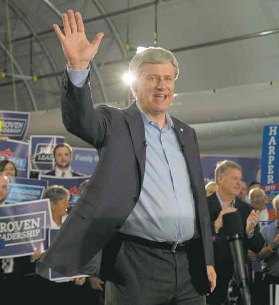 CPTory Leader Stephen Harper waves to supporters.