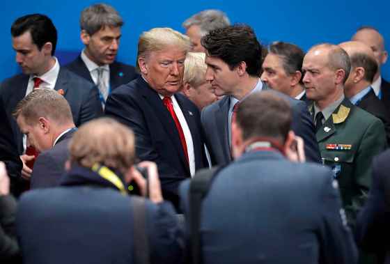 Evan Vucci / The Associated PressU.S. President Donald Trump, centre left, and Canadian Prime Minister Justin Trudeau arrive for a round table meeting during a NATO leaders meeting on Wednesday.