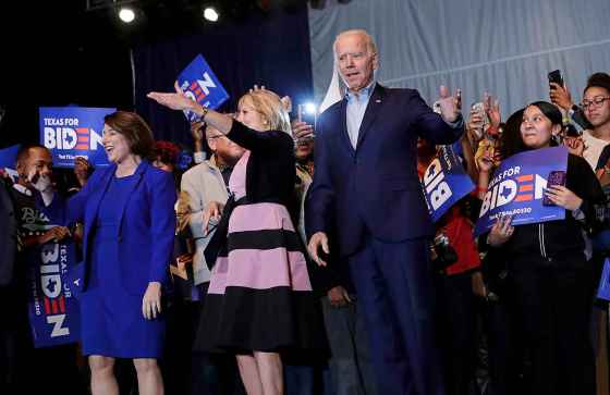 Eric Gay / The Associated PressDemocratic presidential candidate former vice president Joe Biden, right, is joined by former rival Sen. Amy Klobuchar, left, during a campaign stop in Dallas, Monday. At center is Jill Biden.