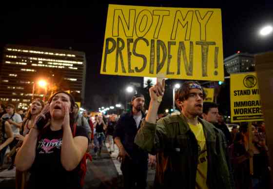 Keith Birmingham / The Pasadena Star-News / The Associated PressProtesters march through downtown along Spring Street during a protest against President-elect, Donald Trump, Wednesday, in Los Angeles.