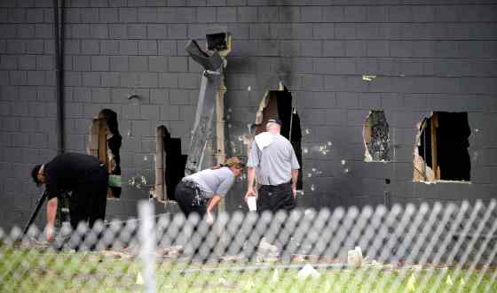 Phelan M. Ebenhack / The Associated PressPolice officials investigate the back of the Pulse nightclub after a shooting involving multiple fatalities at the nightclub in Orlando, Fla., Sunday.